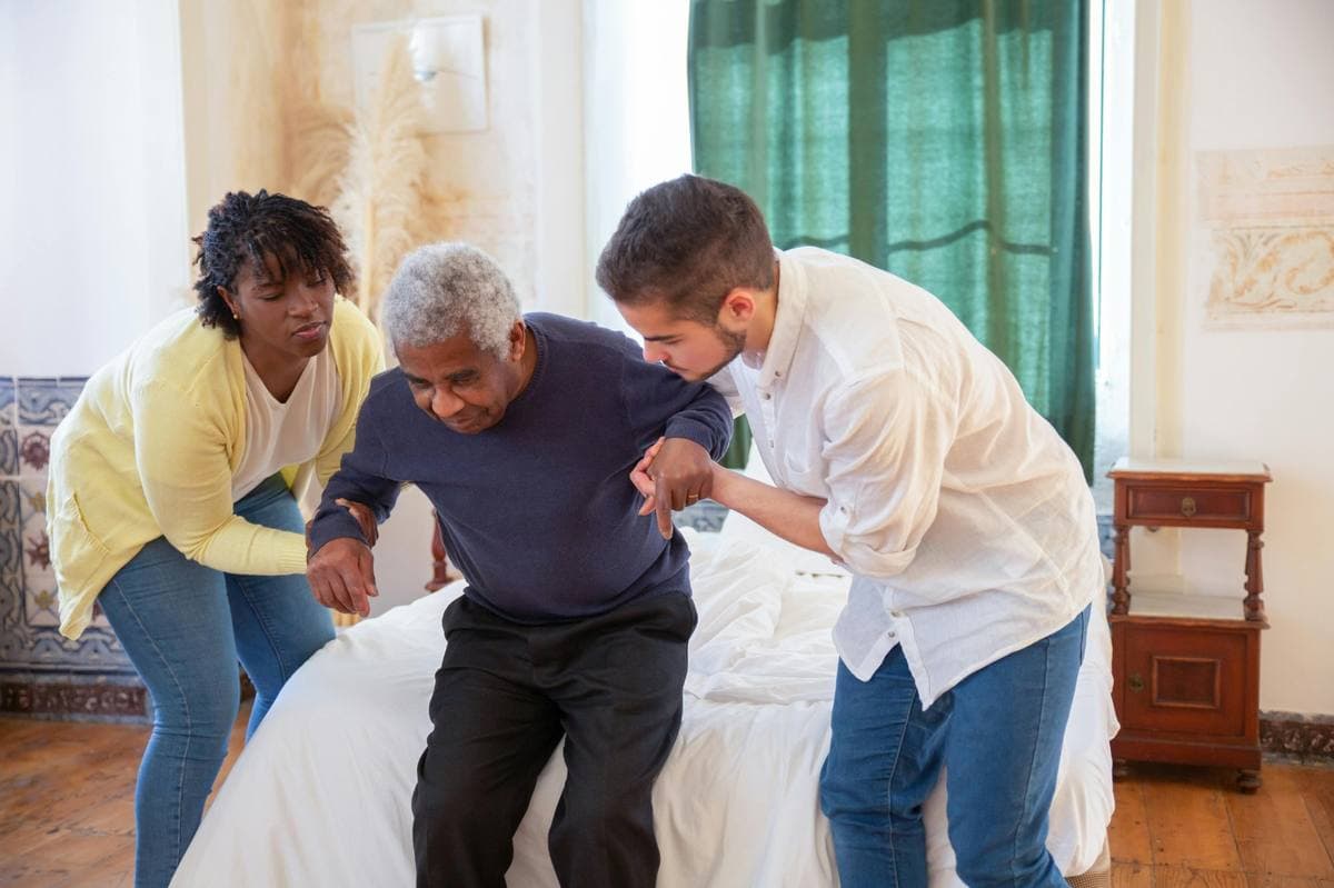 TrueCare caregivers assisting client at home